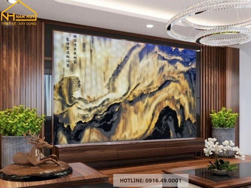 Bức tranh đá ốp tường không chỉ là vật trang trí ấn tượng mà còn thể hiện gu thẩm mỹ tinh tế của gia chủ, kiến tạo không gian phòng khách sang trọng và đẳng cấp